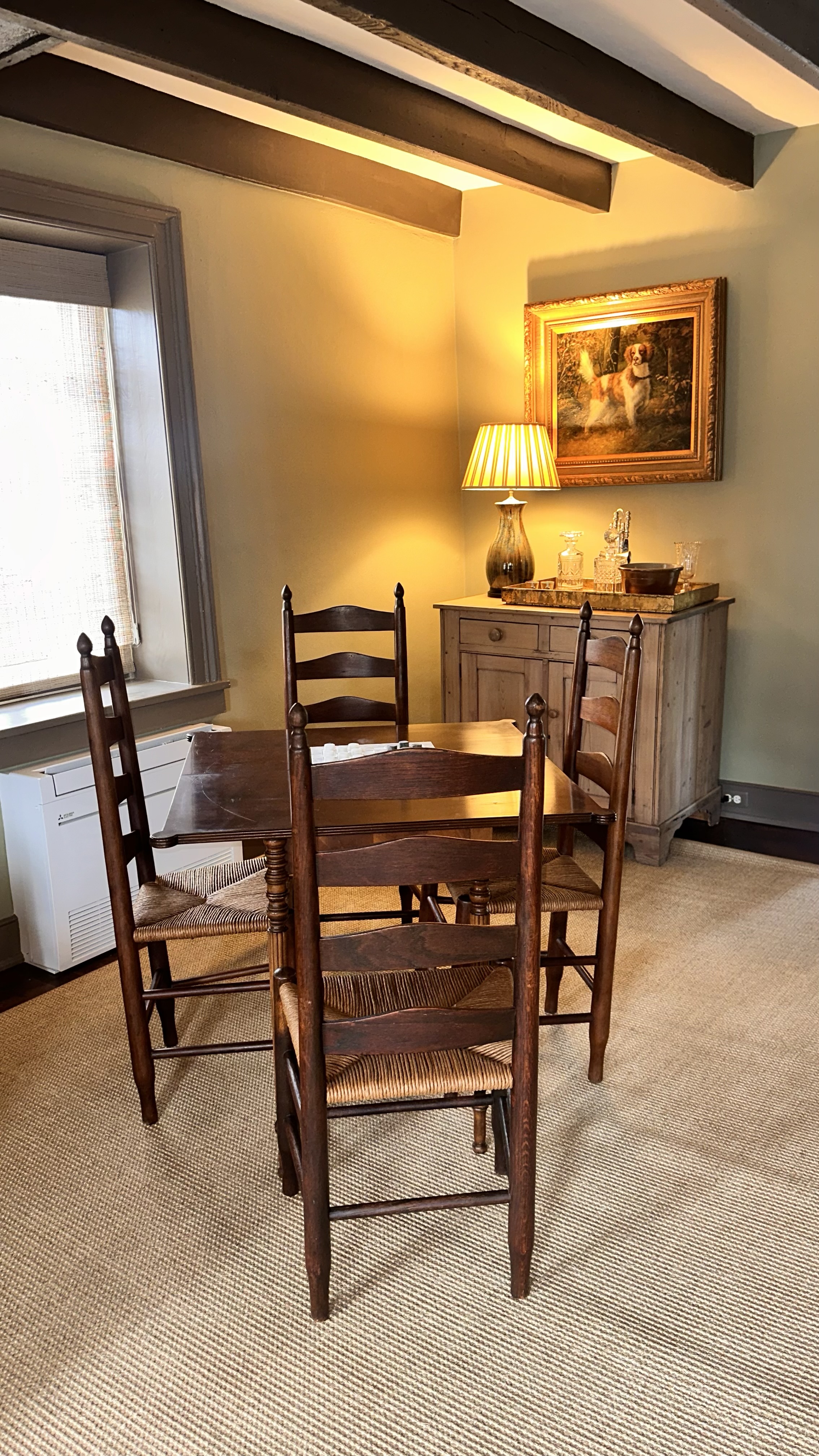 game table with four ladder back chairs