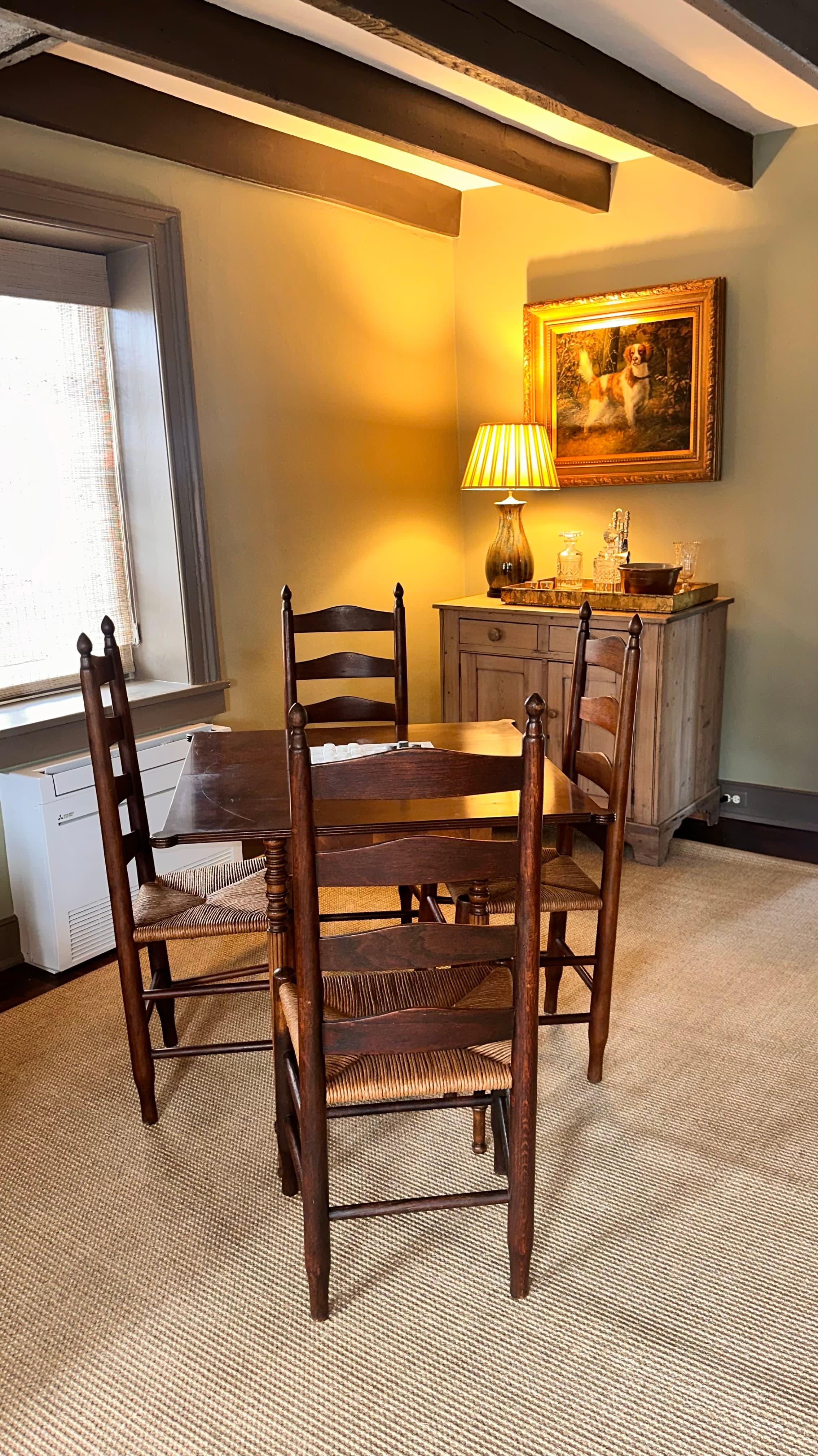 game table with four ladder back chairs