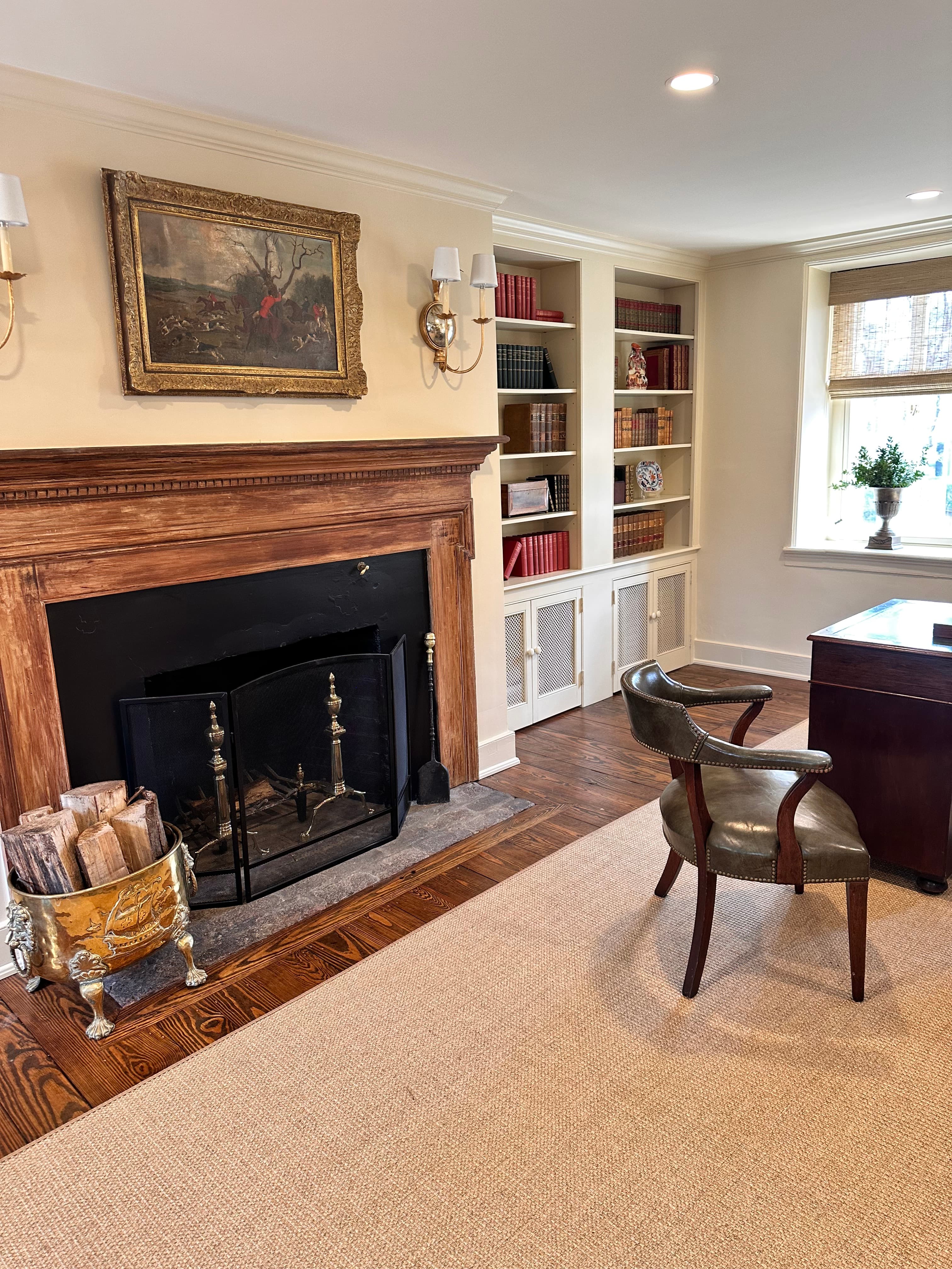 reception room fireplace and book shelves with books