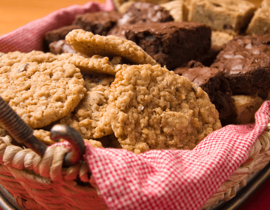 A basket filled with assorted cookies and brownies.