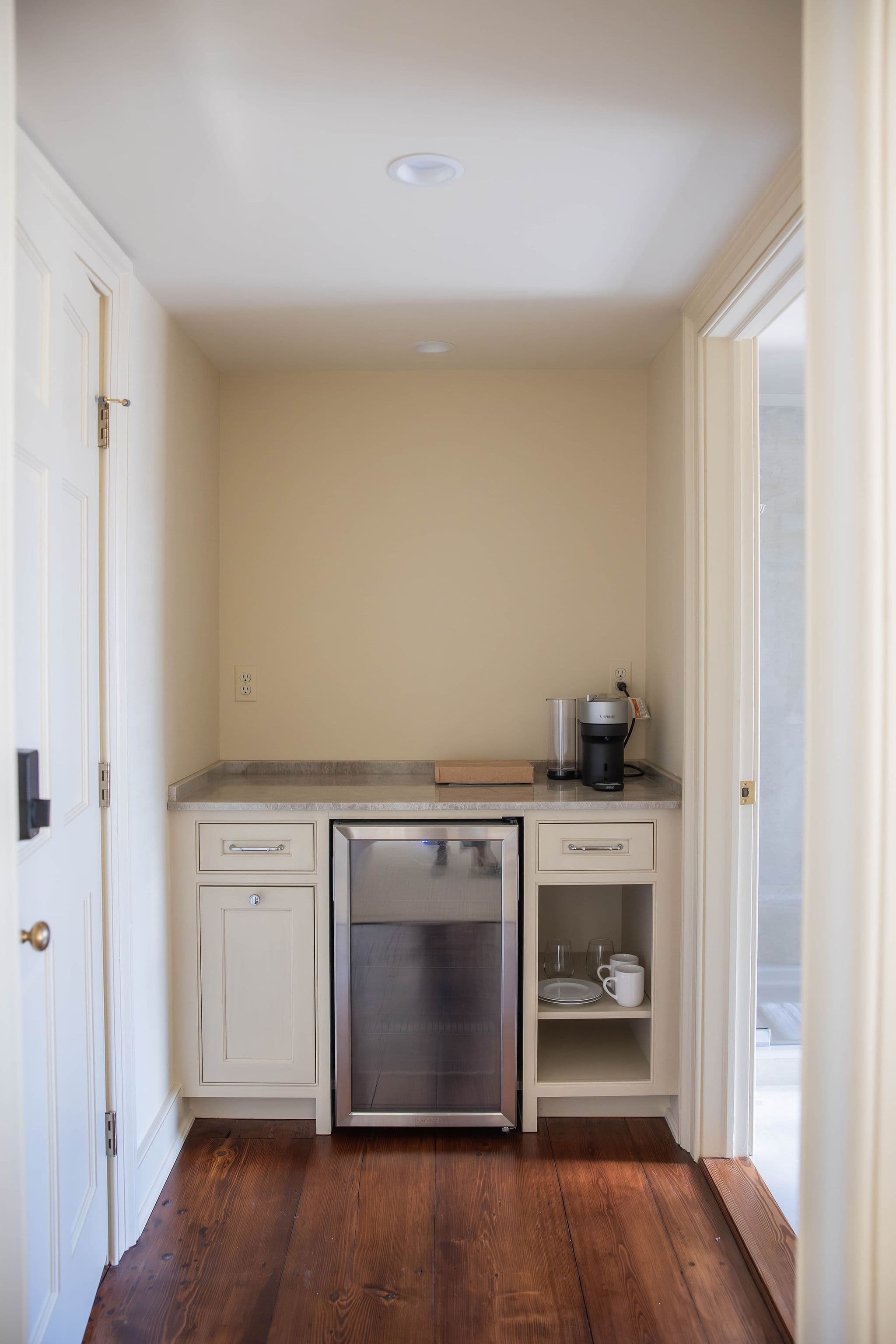 hospitality bar with Nespresso machine and undercounter refrigerator